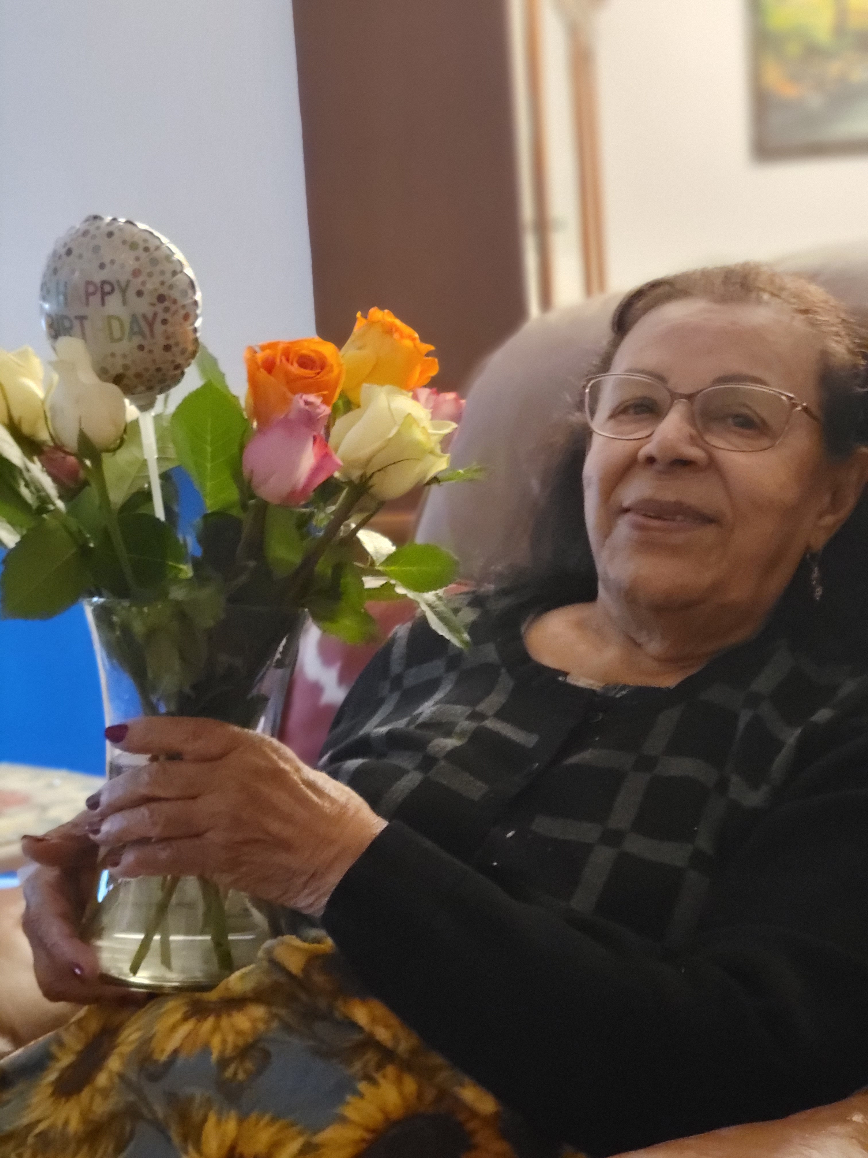 My beautiful 88 years old mom, with the flowers she got from M.