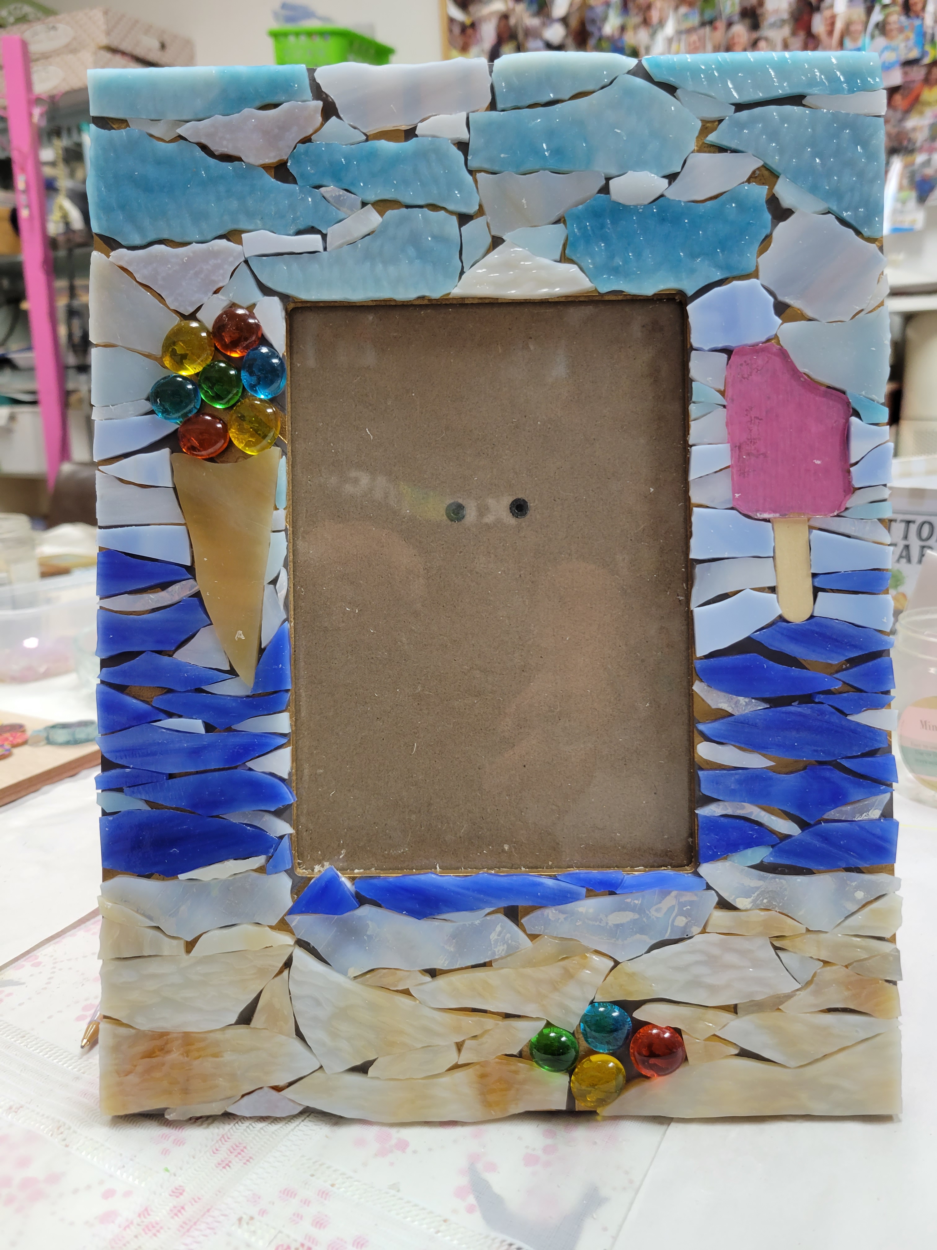 I don't have a photo of this one finished, as it is in NY.  It is missing the grout on this one.  This one I made for Michael.  The first couple of times we went to the beach here we go we got ice-creams from the truck that drives up and down the beach.